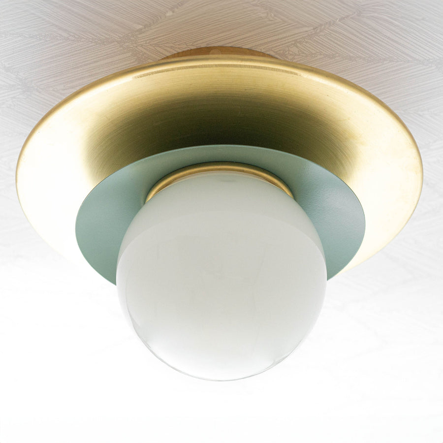 Semi-flush ceiling light with white globe, raw brass circular base, and muted green accent ring. - CEILING LIGHT MODEL NO. 5368