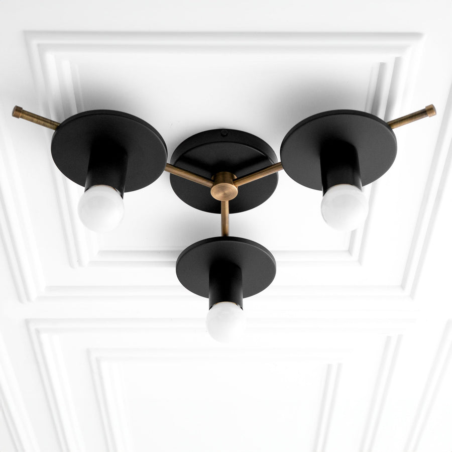 Mid-century modern flush mount chandelier with three black metal shades and antique brass accents. - CHANDELIER MODEL NO. 9526