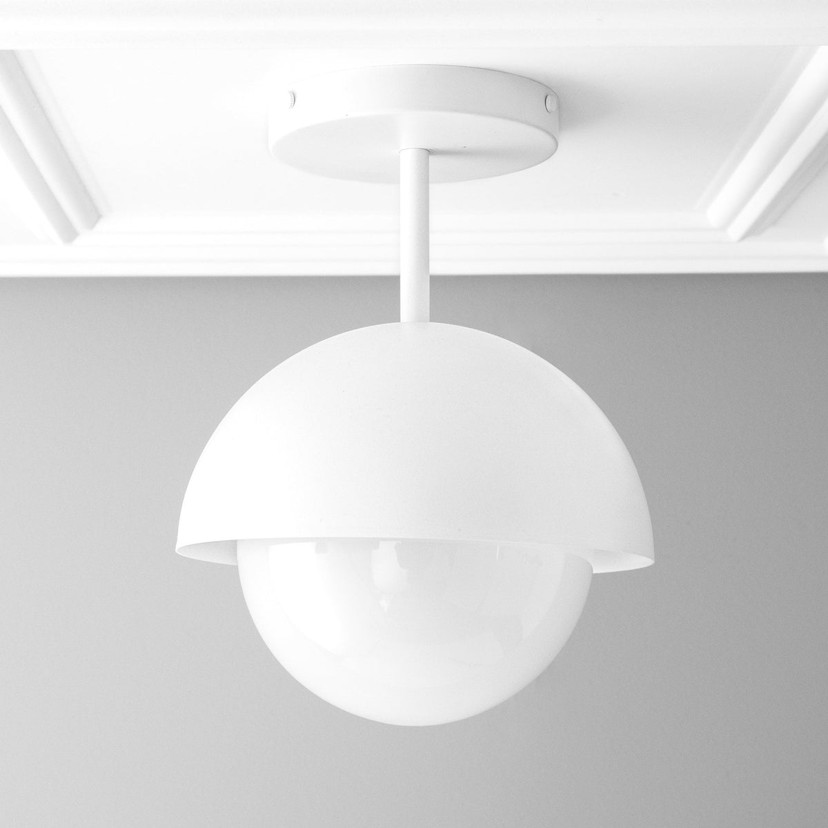 White dome pendant light with smooth matte finish and globe-shaped diffuser. - PENDANT MODEL NO. 6357