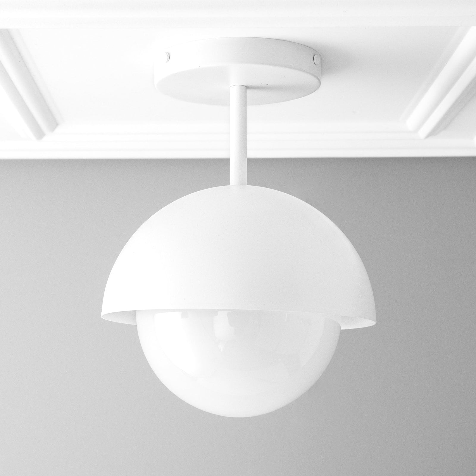 White dome pendant light with smooth matte finish and globe-shaped diffuser. - PENDANT MODEL NO. 6357