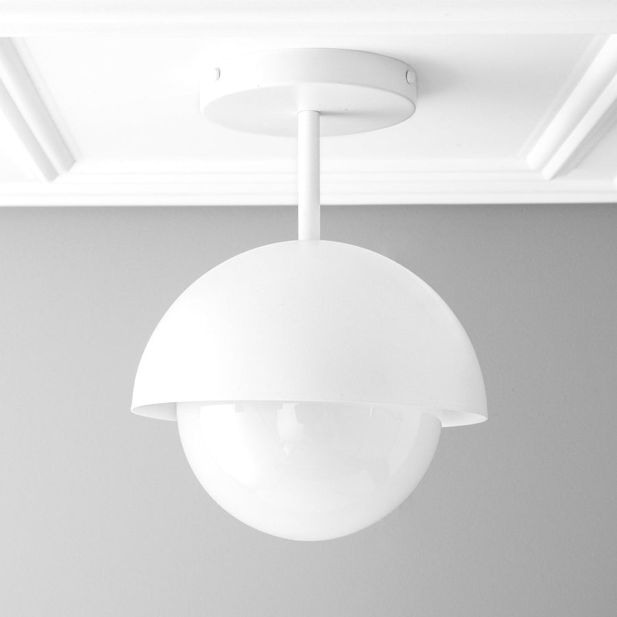 White dome pendant light with smooth matte finish and globe-shaped diffuser. - PENDANT MODEL NO. 6357