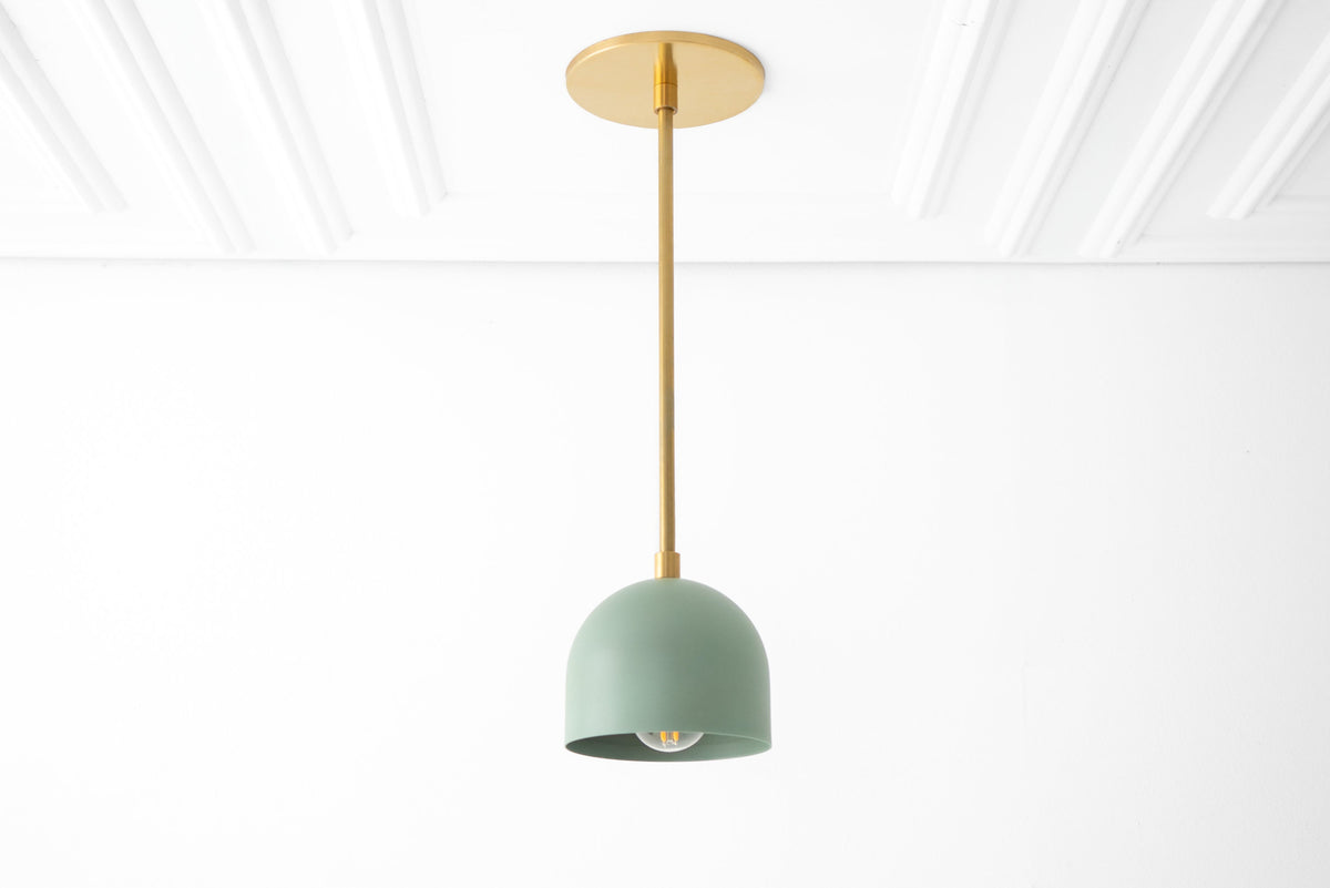Raw brass pendant light with matte green Scandinavian-style shade and ceiling mount. - PENDANT MODEL NO. 8906