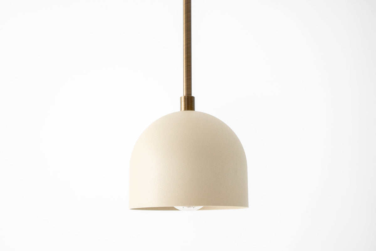 Antique brass pendant light with smooth cream shade and minimalist Scandinavian design. - PENDANT MODEL NO. 8906