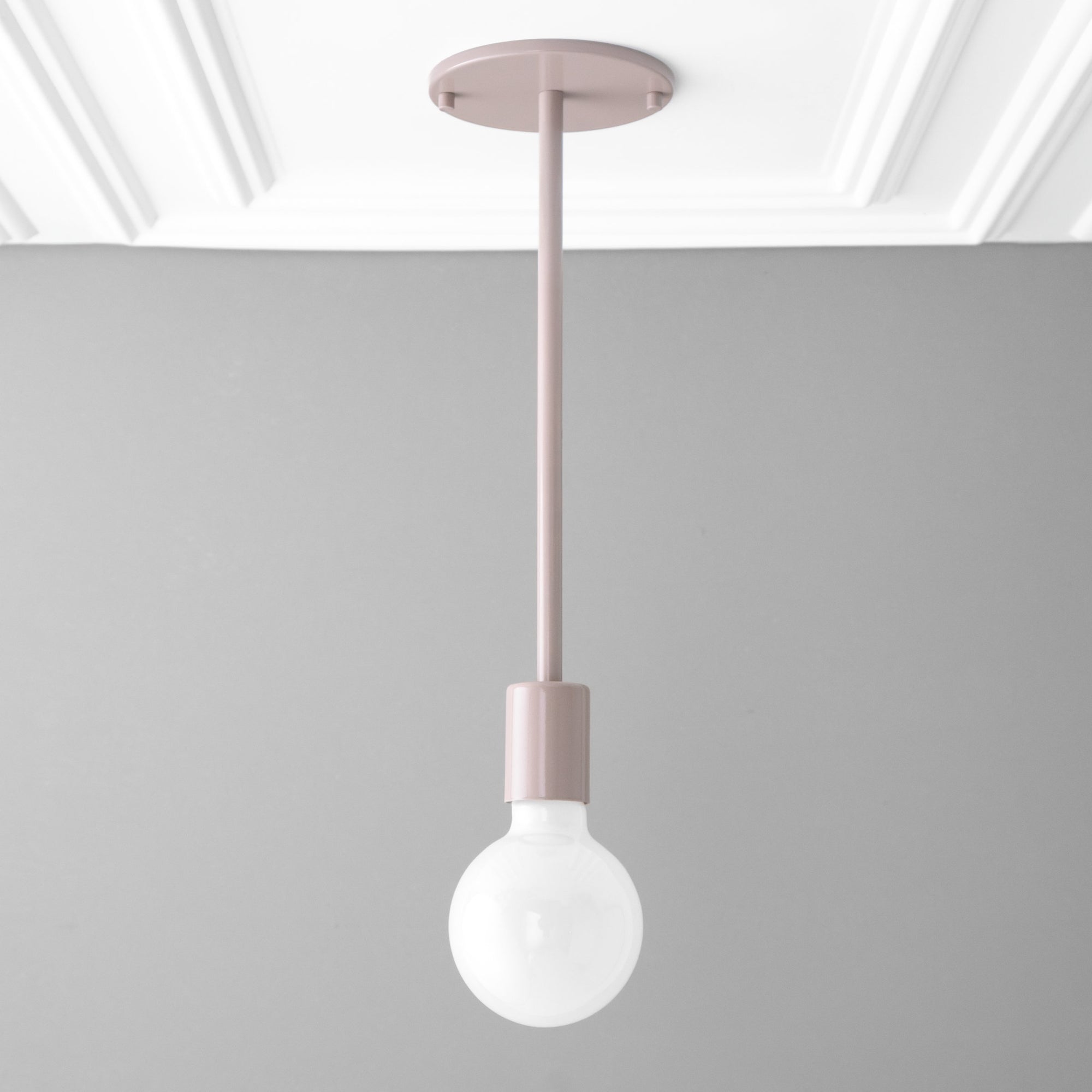 Scandinavian-style mauve pendant light with a bare round bulb and cylindrical holder. - PENDANT MODEL NO. 6558
