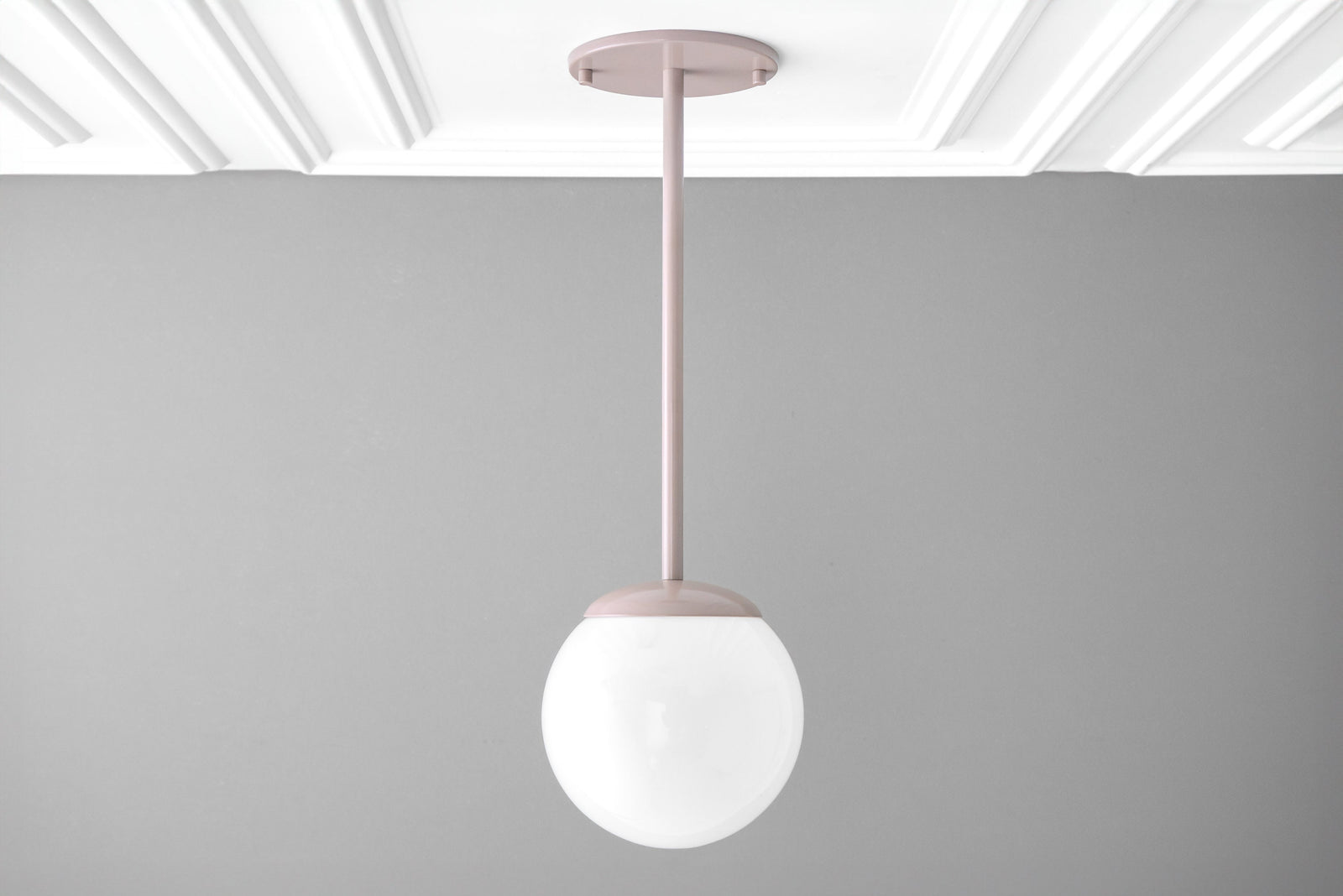 Mid-century modern pendant light with matte brick red metal fixture and frosted white globe shade. - PENDANT MODEL NO. 7559