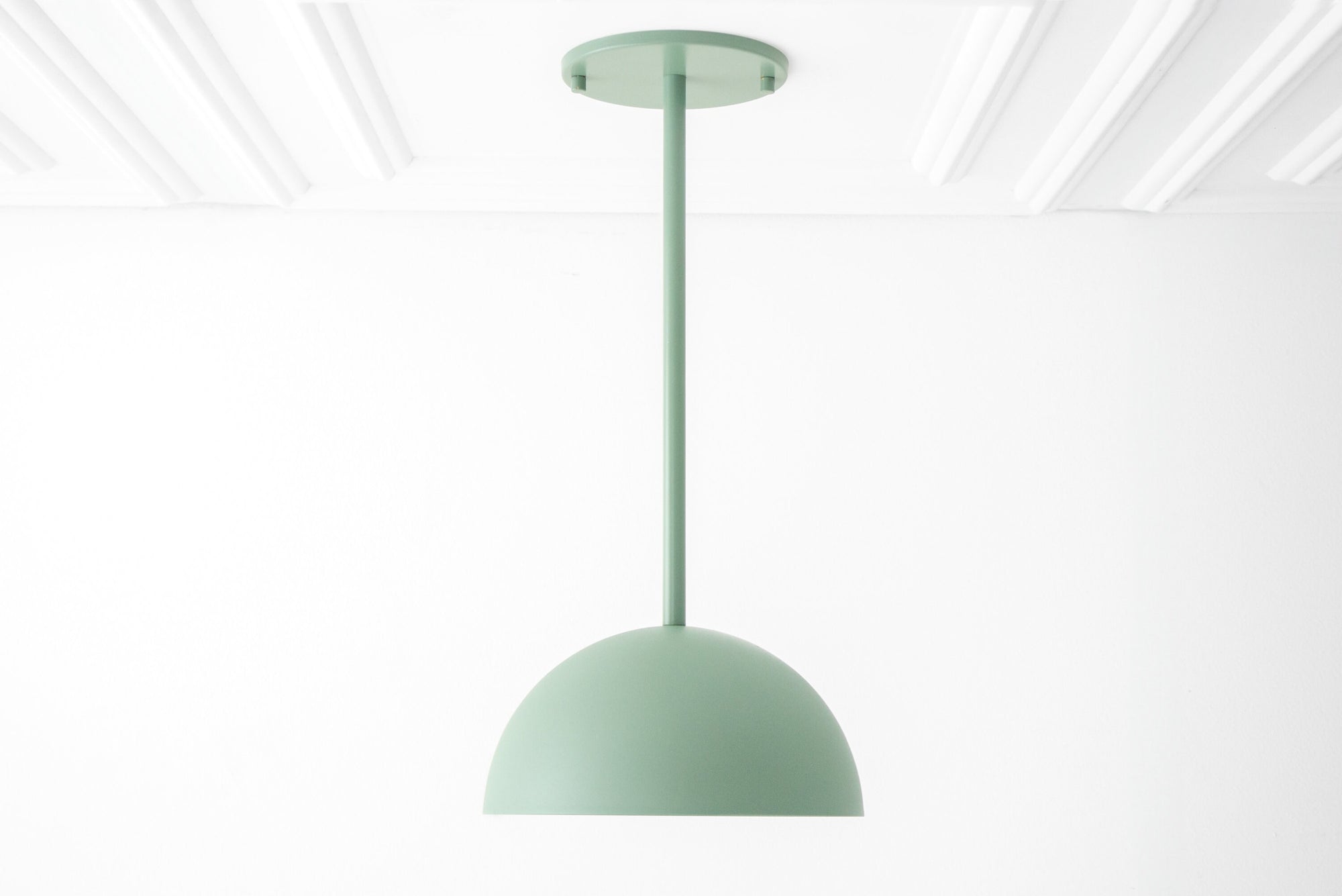 Matte light green dome pendant light with minimalist Scandinavian design hanging from ceiling mount. - PENDANT MODEL NO. 9770