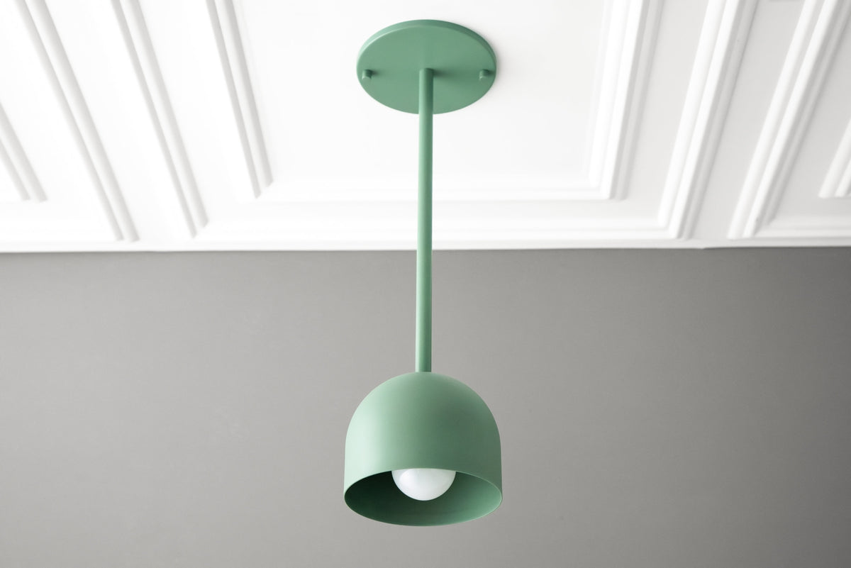 Matte green Scandinavian pendant light with deep dome shade, hanging from ceiling mount. - PENDANT MODEL NO. 4745