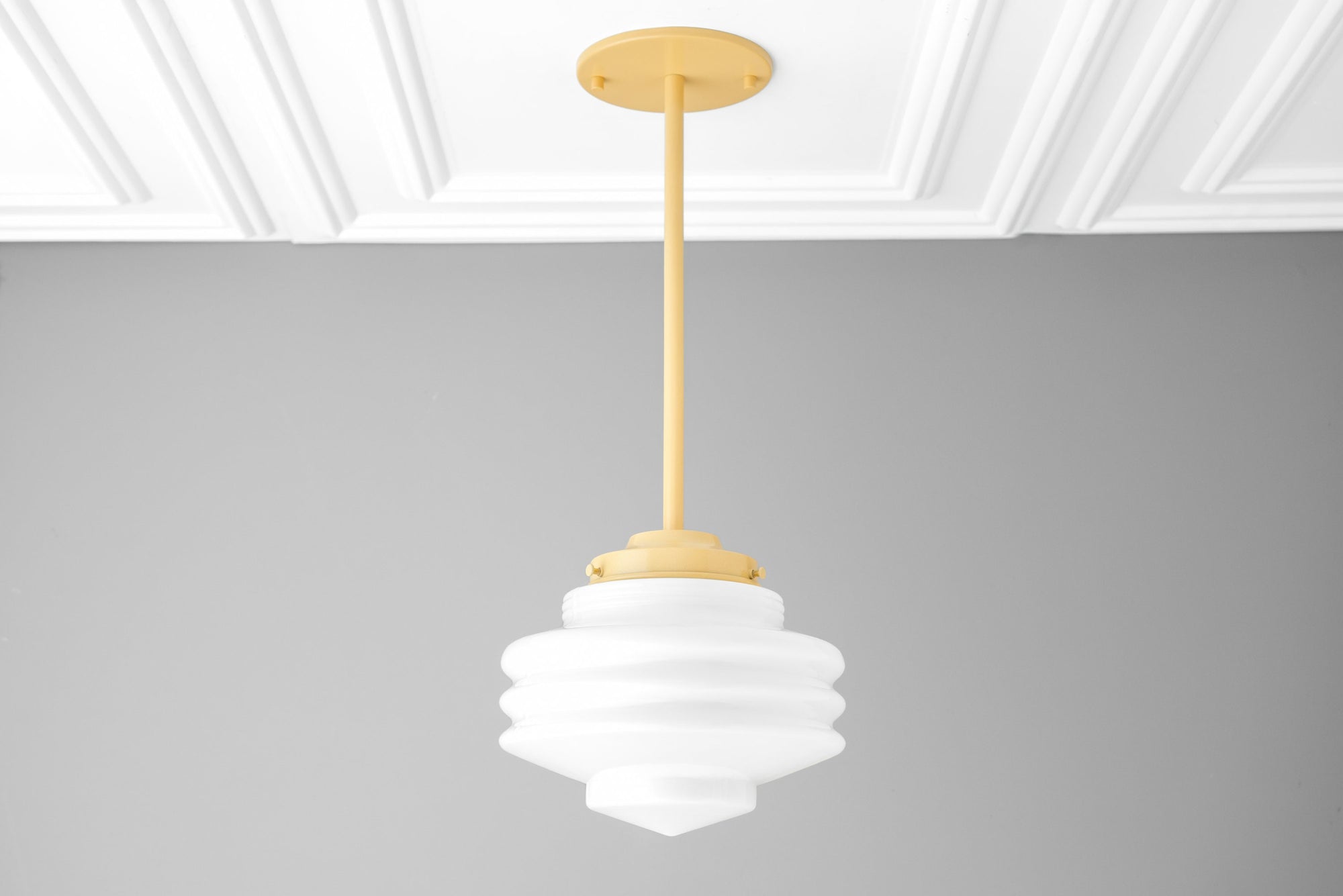 Art Deco style white globe pendant light with tiered geometric design and matte gold ceiling mount. - PENDANT MODEL NO. 6388