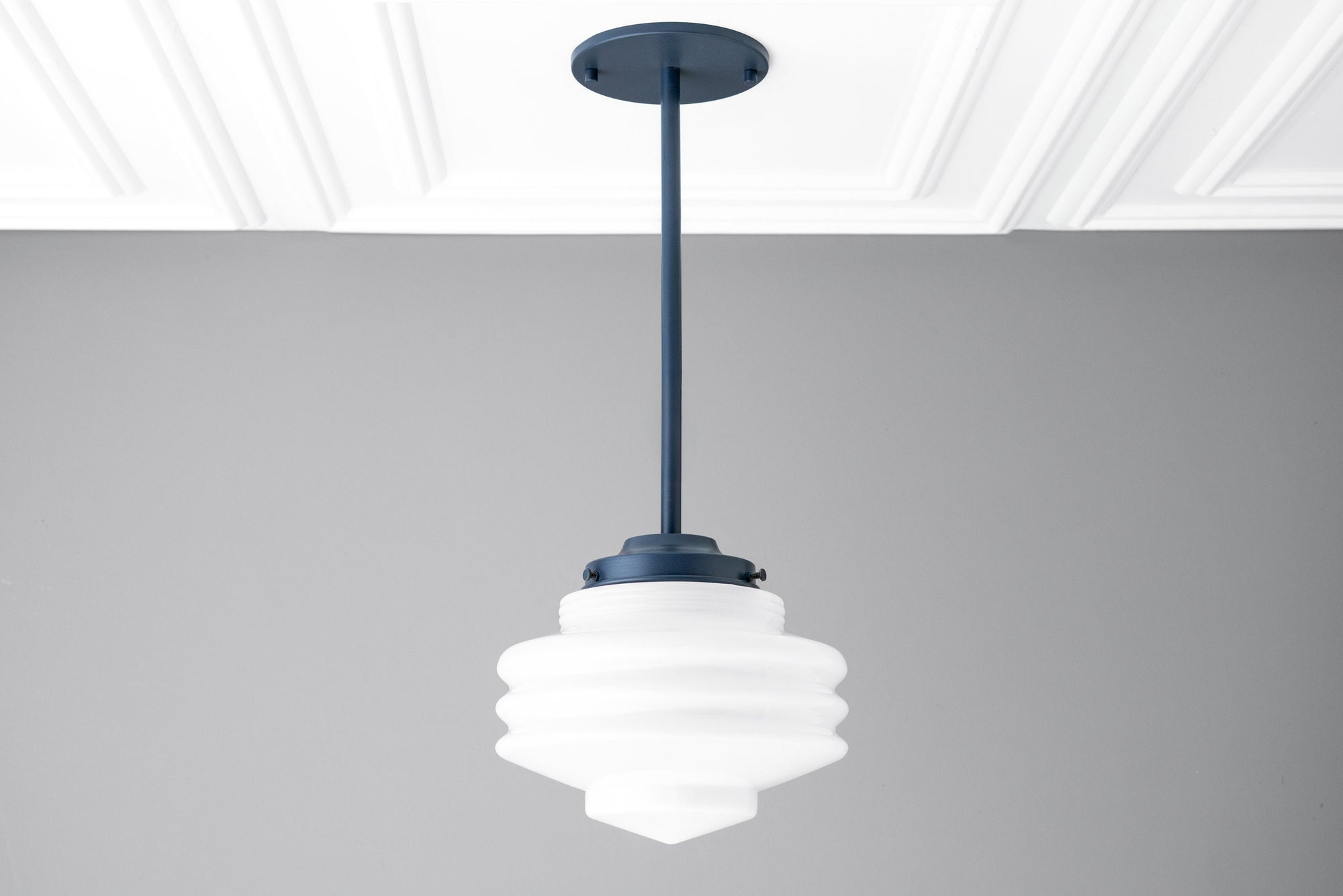 Art Deco white globe pendant light with layered glass design and navy blue mount. - PENDANT MODEL NO. 6388