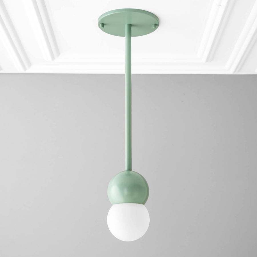 Scandinavian pendant light with green matte globe and white frosted glass orb shade. - PENDANT MODEL NO. 6129