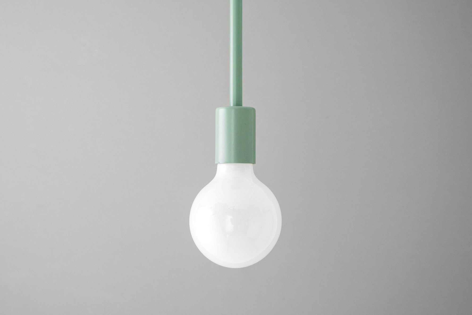 Mauve Scandinavian bare bulb pendant light with matte finish and fabric cord. - PENDANT MODEL NO. 6558