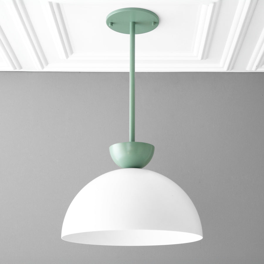 Scandinavian-style pendant light with matte green fixture and white dome shade. - PENDANT MODEL NO. 2287