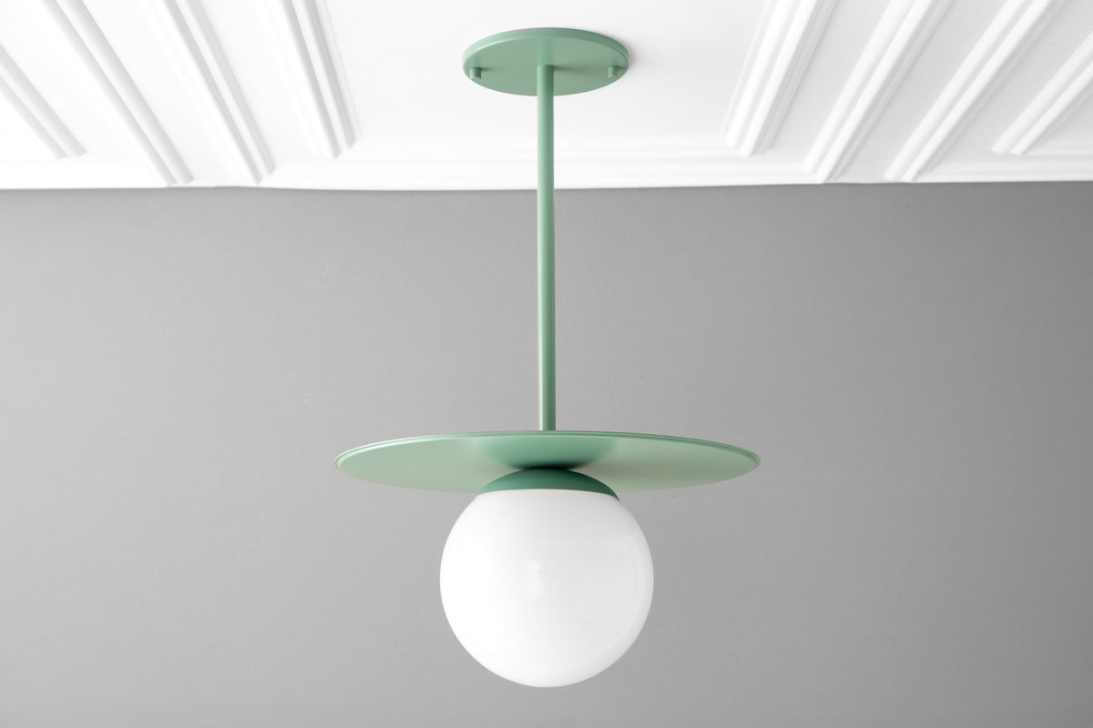 Matte green Scandinavian pendant light with round globe shade and flat disc canopy. - PENDANT MODEL NO. 8548