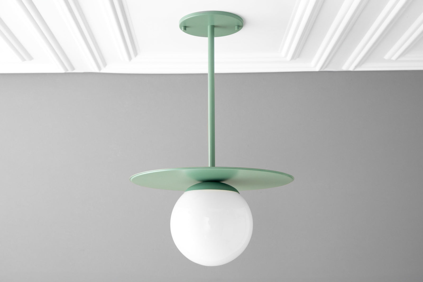 Matte green Scandinavian pendant light with round globe shade and flat disc canopy. - PENDANT MODEL NO. 8548