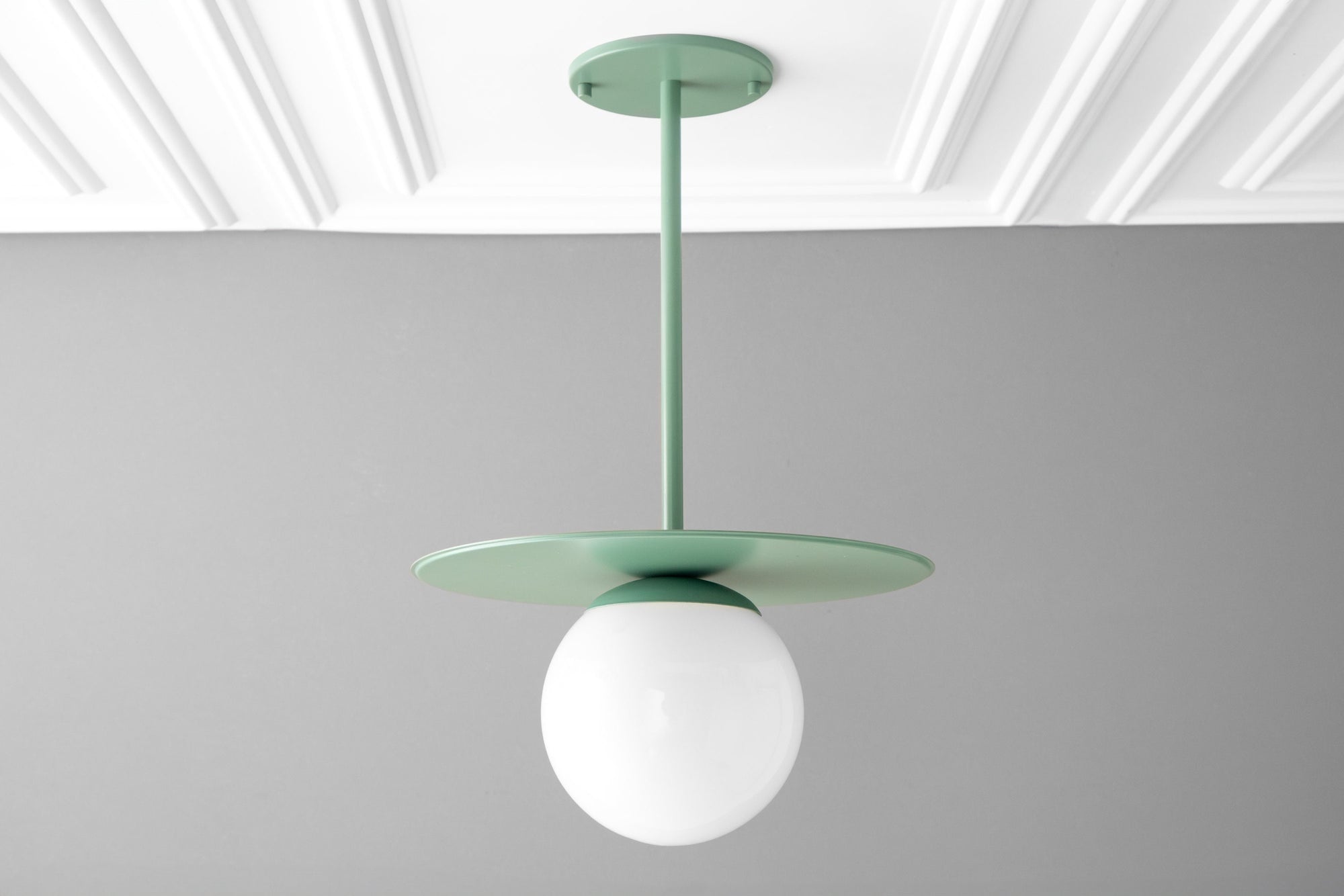 Matte green Scandinavian pendant light with round globe shade and flat disc canopy. - PENDANT MODEL NO. 8548