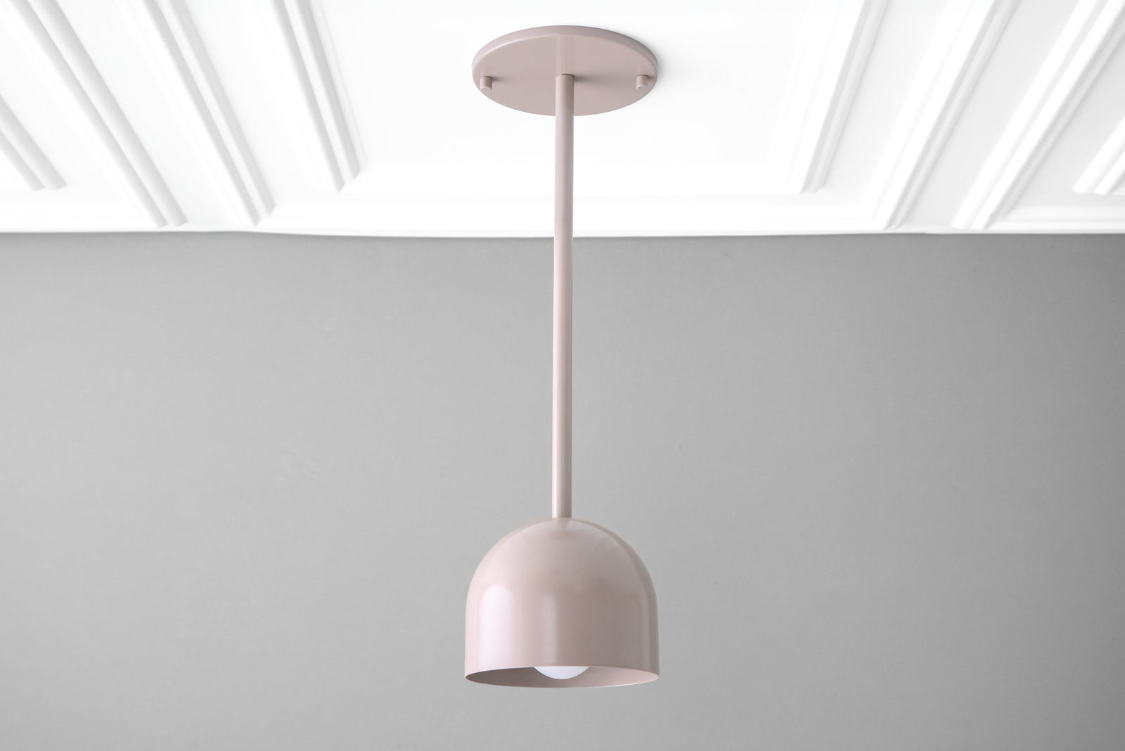 Mauve Scandinavian deep ball pendant light with smooth matte finish hanging against gray wall. - PENDANT MODEL NO. 4745