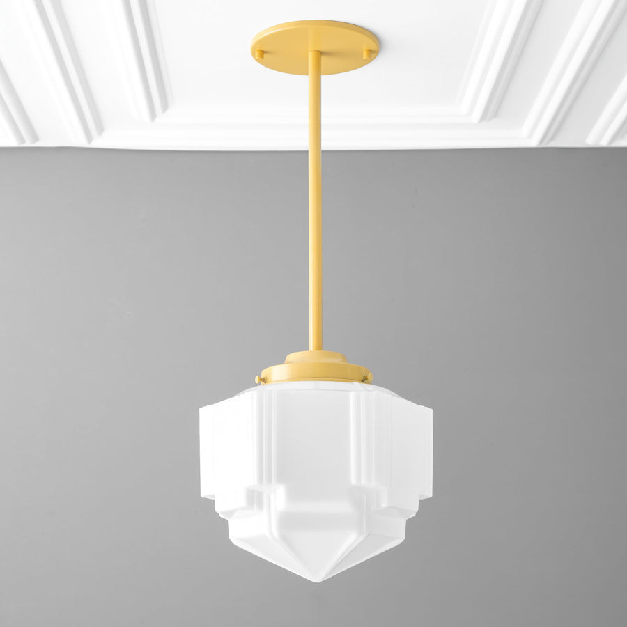 Art Deco white glass globe pendant with matte yellow metal fixture and rod. - PENDANT MODEL NO. 6311