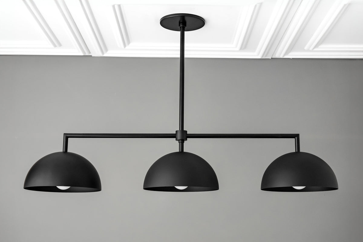 Black industrial chandelier with three dome-shaped metal shades and horizontal rod design. - CHANDELIER MODEL NO. 3606