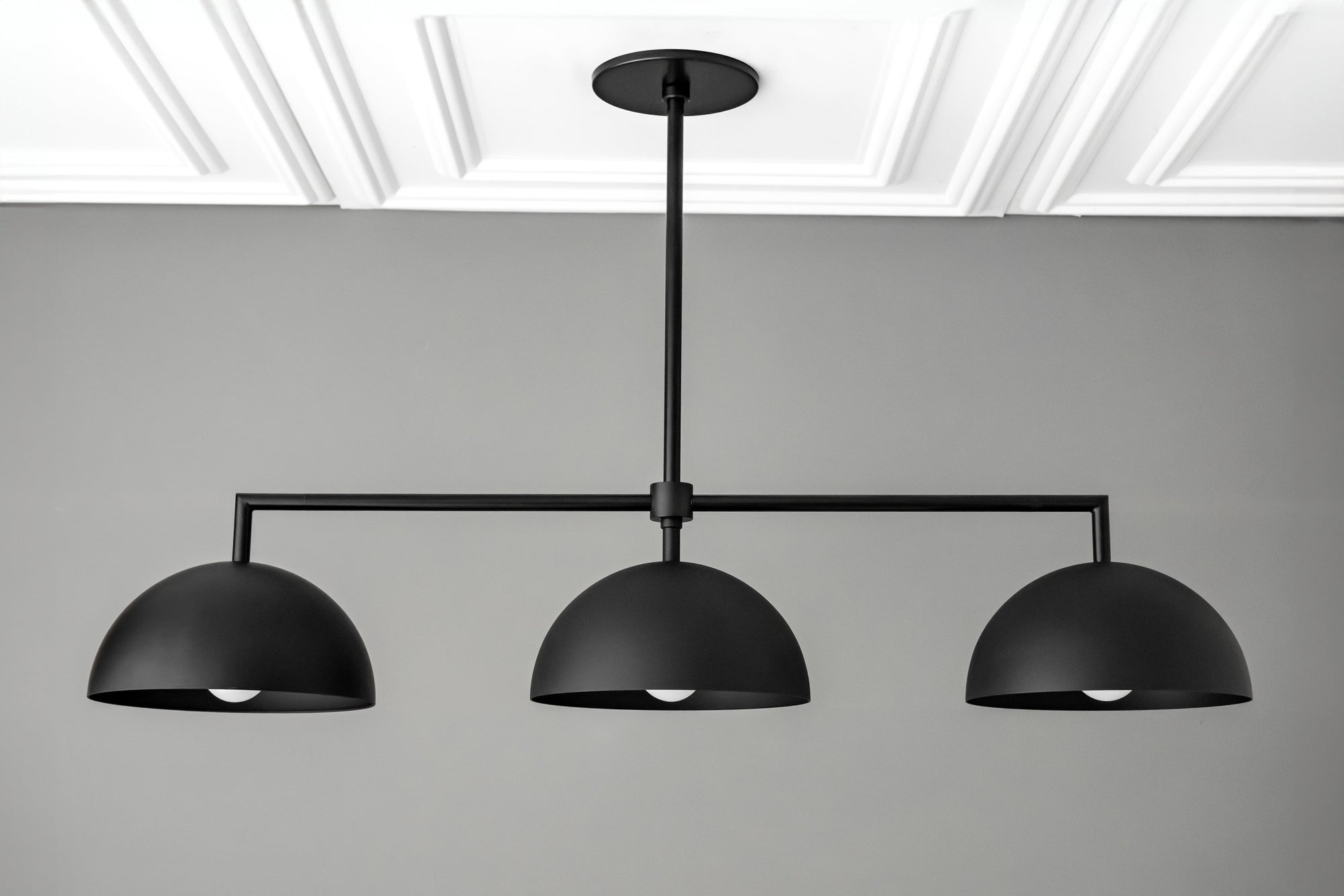 Black industrial chandelier with three dome-shaped metal shades and horizontal rod design. - CHANDELIER MODEL NO. 3606