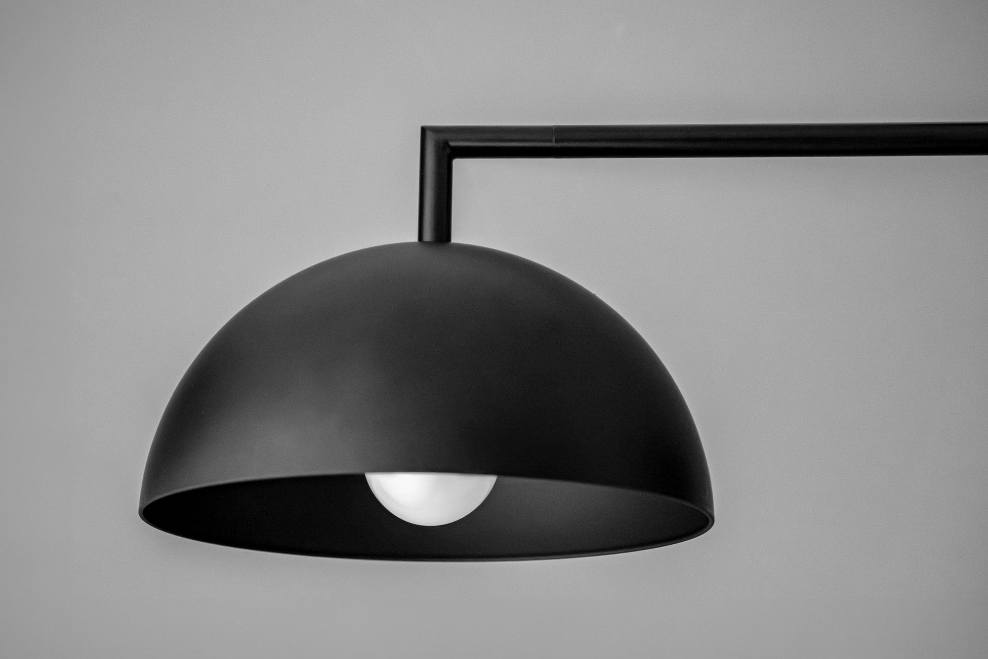 Black industrial dome-shaped chandelier with exposed bulb and minimalist arm mount. - CHANDELIER MODEL NO. 3606