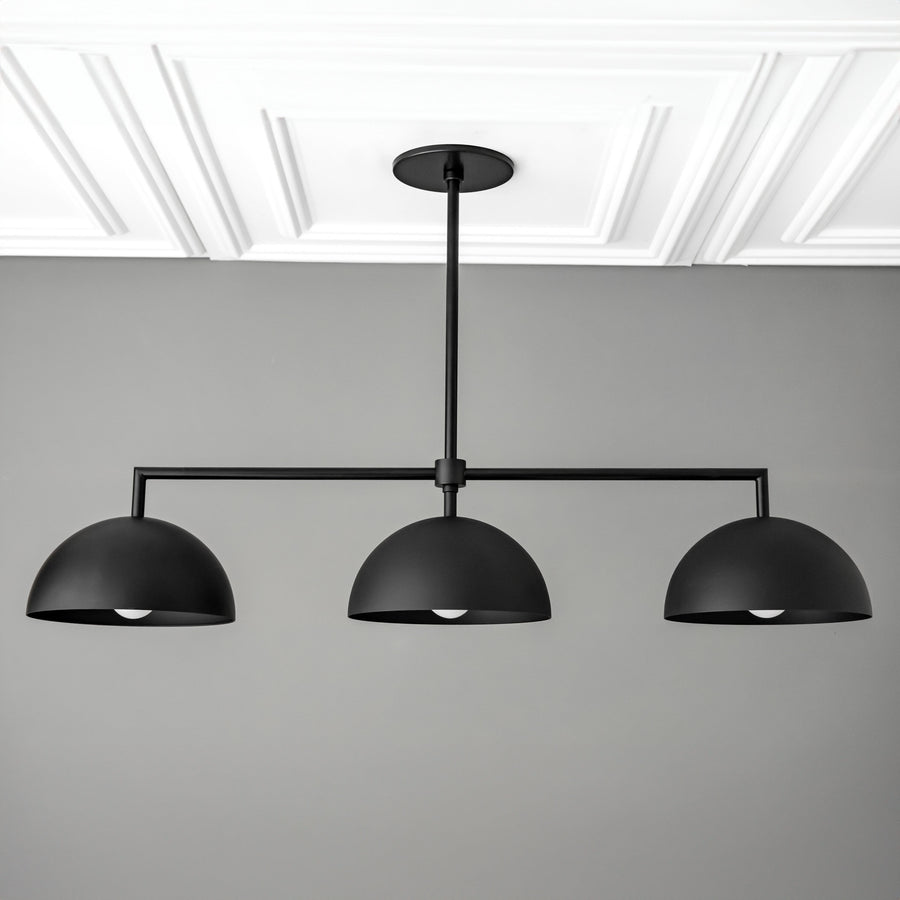 Black industrial chandelier with three dome-shaped shades suspended from horizontal rod. - CHANDELIER MODEL NO. 3606