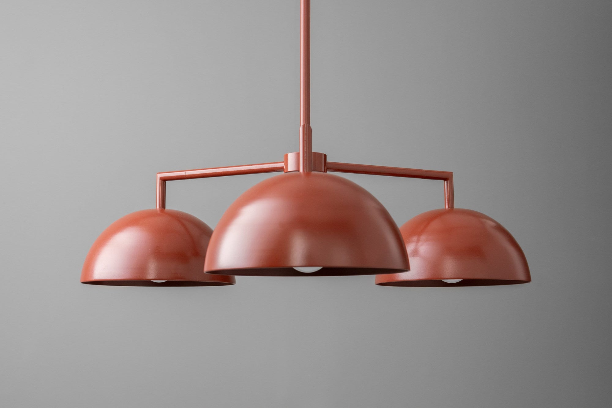 Brick red Scandinavian dome chandelier with three rounded shades on metal frame. - CHANDELIER MODEL NO. 4377