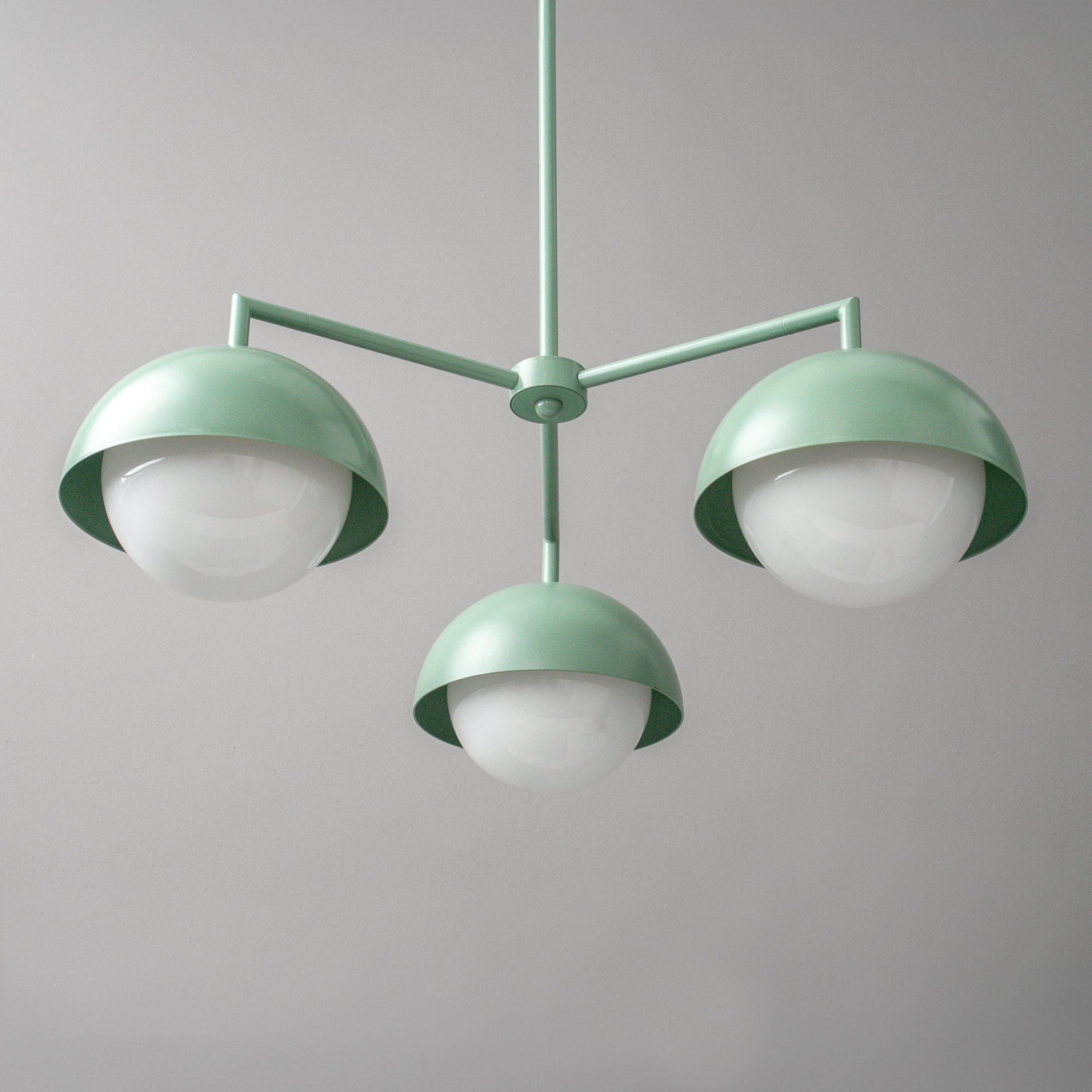 Scandinavian green chandelier with three dome-shaped shades and white globe bulbs. - CHANDELIER MODEL NO. 9420