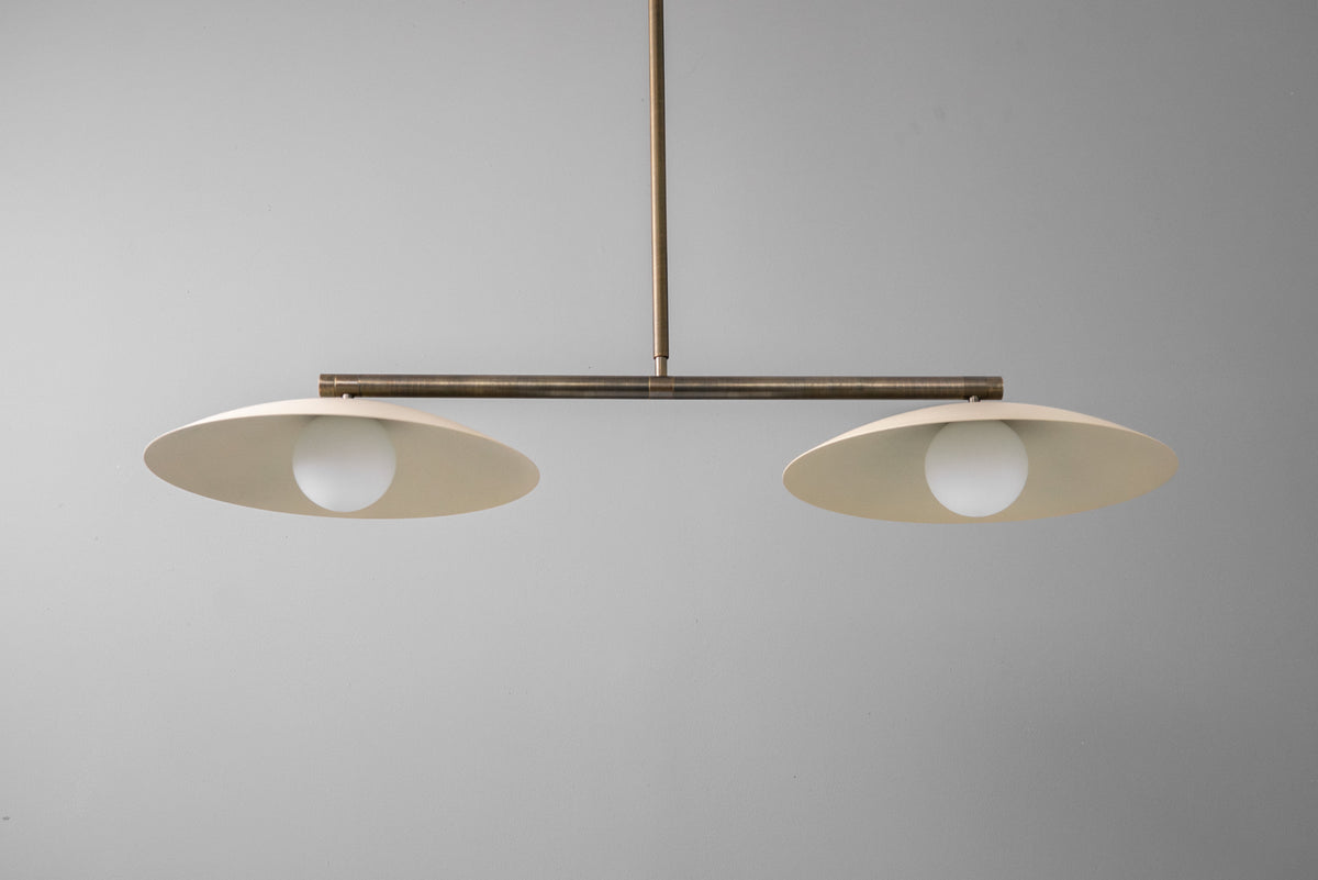 Minimalist linear chandelier with two flat antique brass globe shades and exposed bulbs. - CHANDELIER MODEL NO. 9708