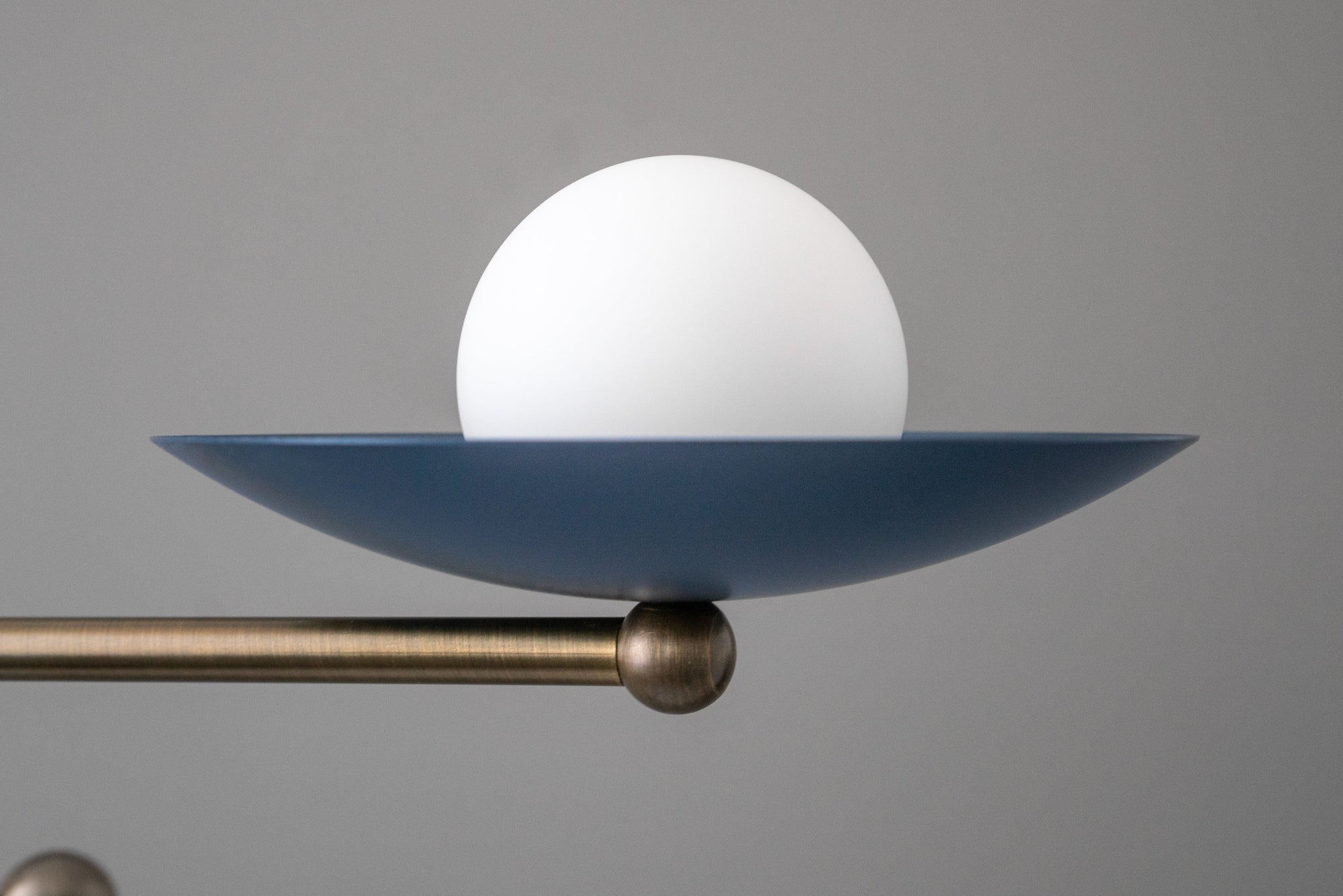 Antique brass chandelier arm with coal blue saucer and white globe light bulb. - CHANDELIER MODEL NO. 2933