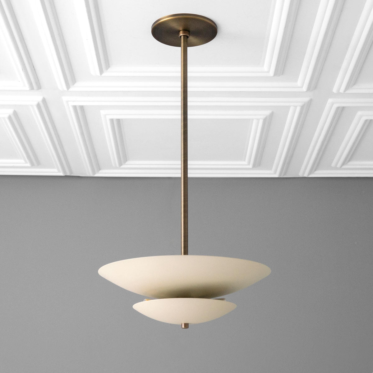 Mid-century modern chandelier with two-tier matte white disc shades and antique brass finish suspension rod. - CHANDELIER MODEL NO. 3434
