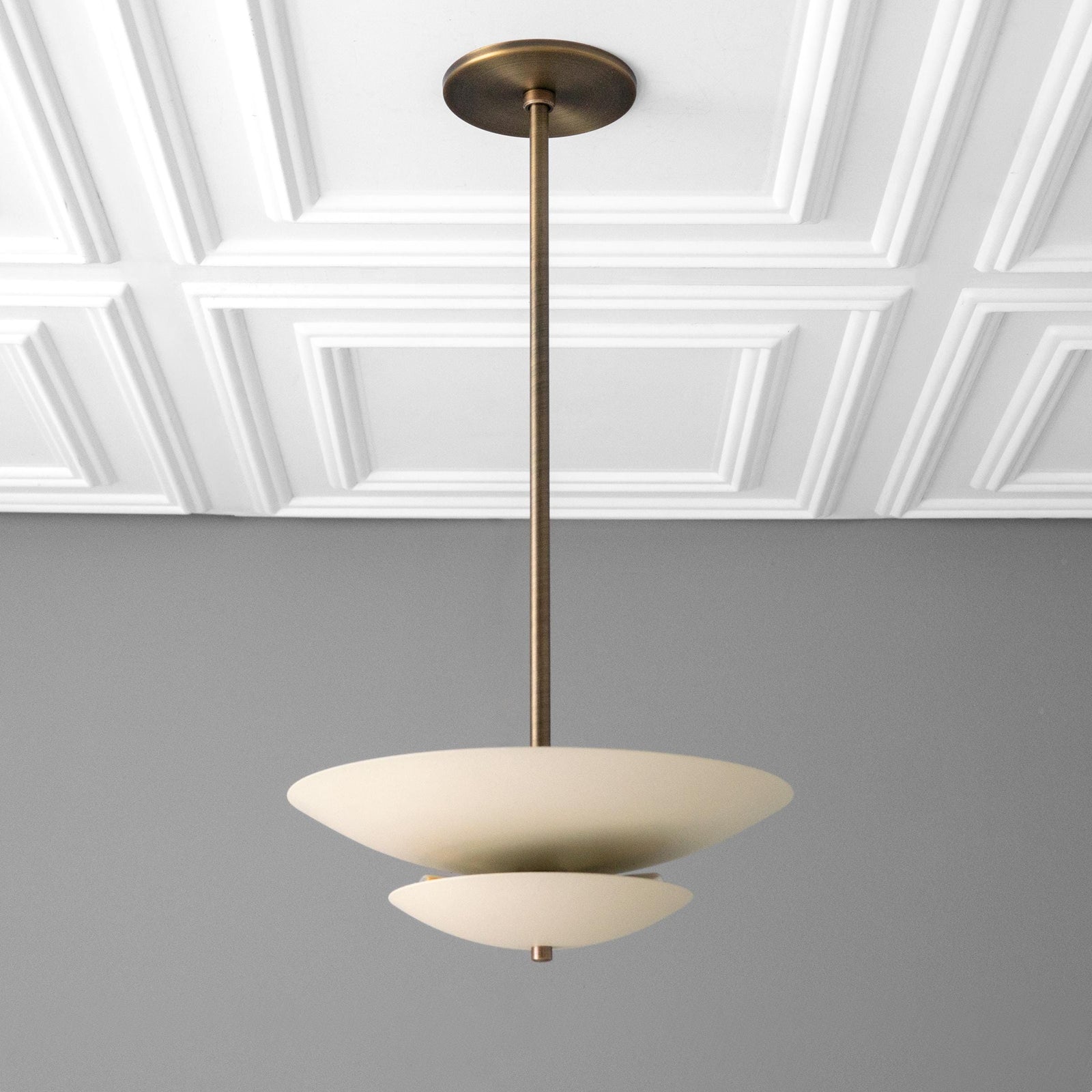 Mid-century modern chandelier with two-tier matte white disc shades and antique brass finish suspension rod. - CHANDELIER MODEL NO. 3434