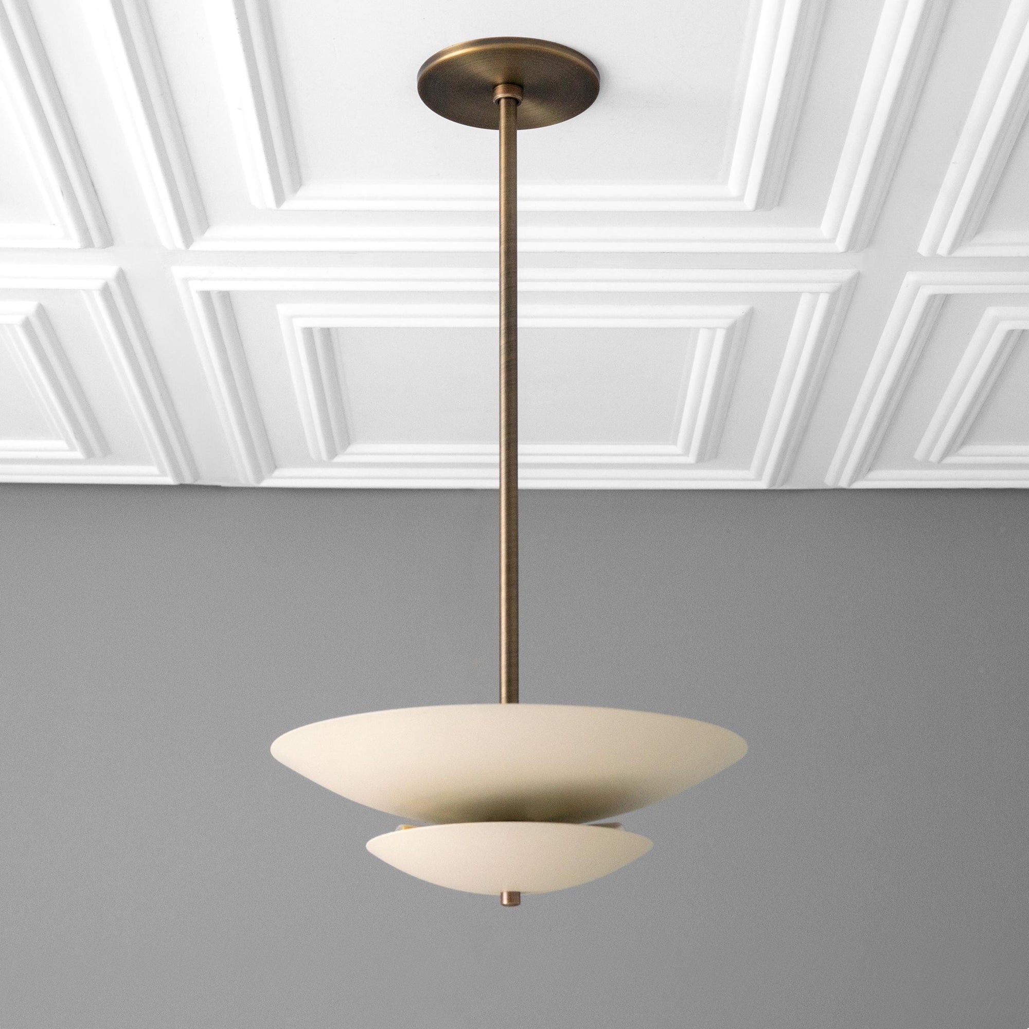 Mid-century modern chandelier with two-tier matte white disc shades and antique brass finish suspension rod. - CHANDELIER MODEL NO. 3434