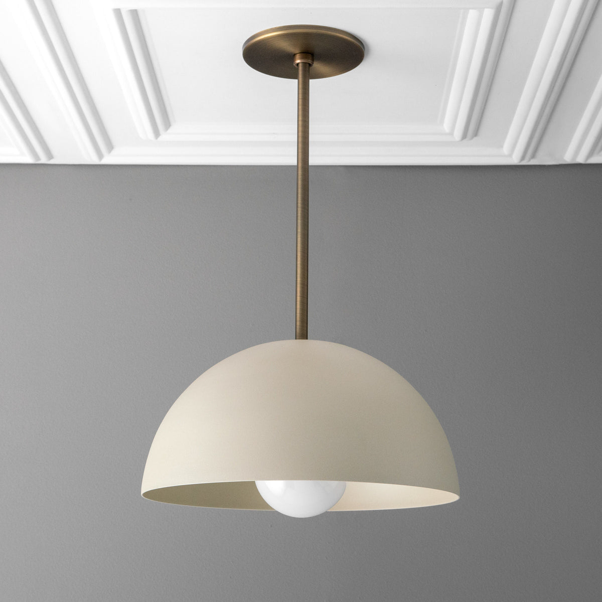 Matte white dome pendant light with antique brass rod and ceiling mount, exposed bulb design. - PENDANT MODEL NO. 6673