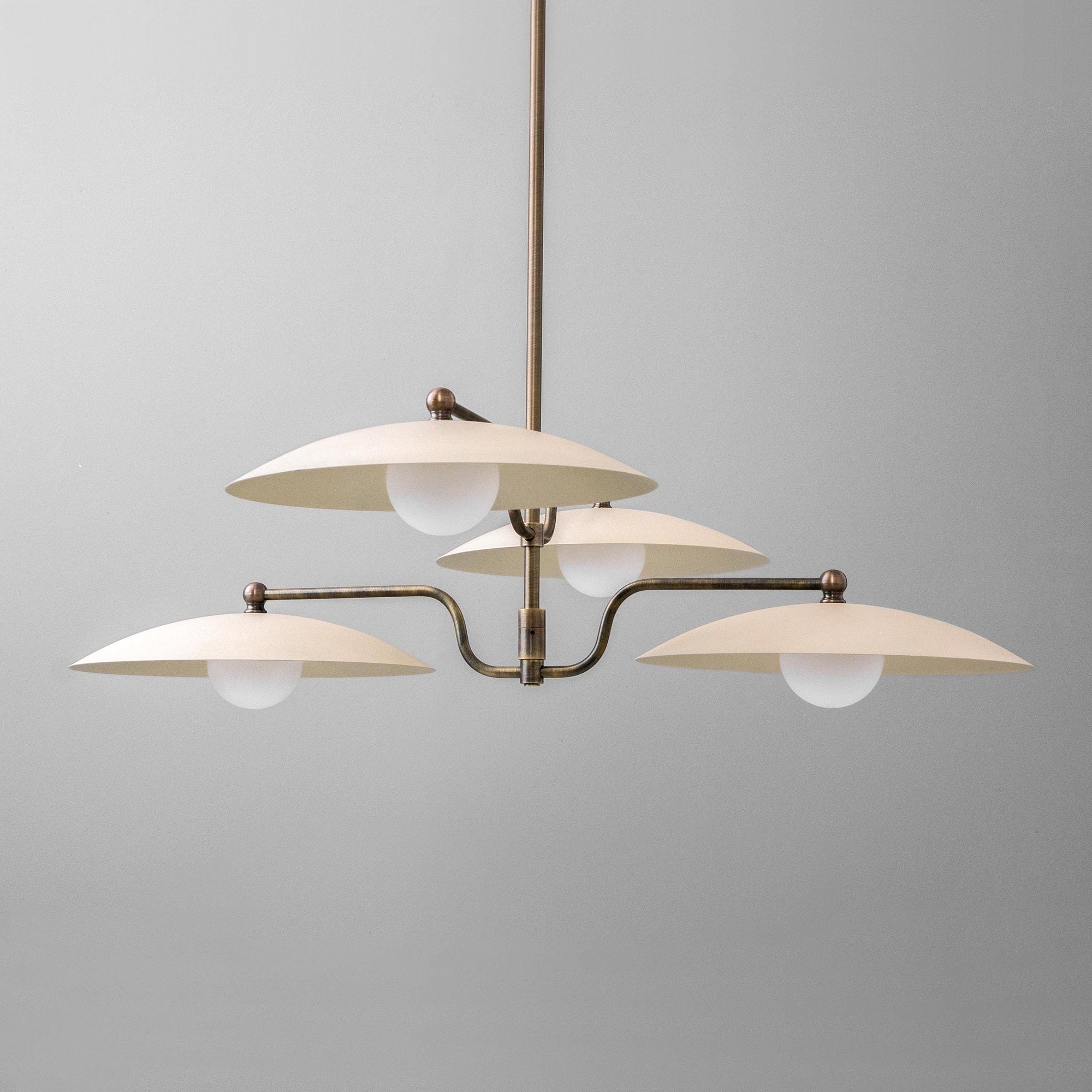 Mid-century modern chandelier with three white globe lights and curved antique brass arms. - CHANDELIER MODEL NO. 1192