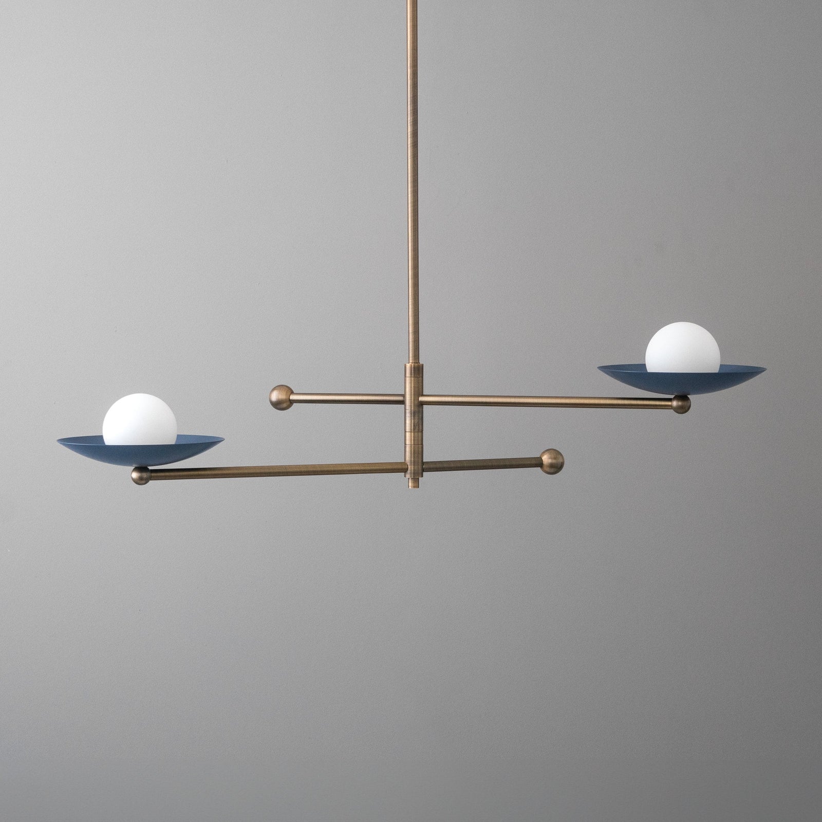 Antique brass chandelier with two horizontal arms and blue metal globe-shaped light shades with white bulbs. - CHANDELIER MODEL NO. 2933