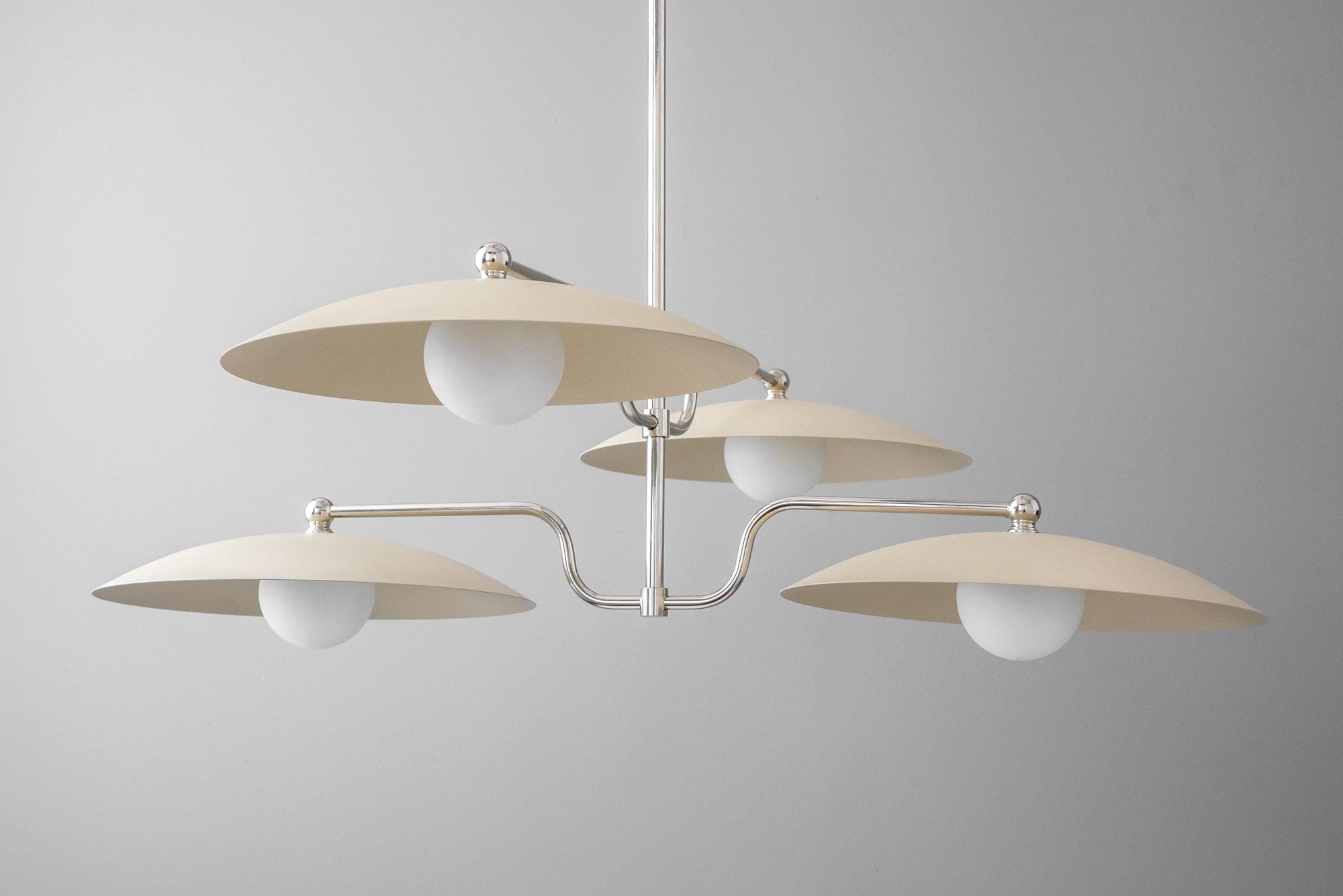 Mid-century modern chandelier with three matte brass disc shades and white globe bulbs. - CHANDELIER MODEL NO. 1192