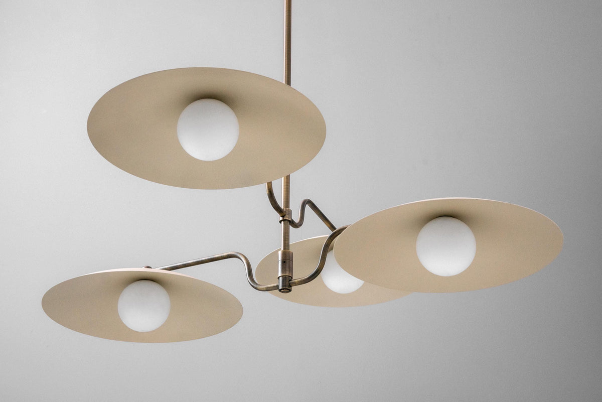 Mid-century modern chandelier with three beige disc-shaped shades and round white bulbs on antique brass arms. - CHANDELIER MODEL NO. 1192