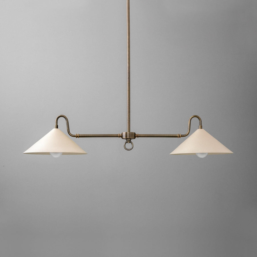 Antique brass linear chandelier with two cream cone-shaped shades on a central rod against gray background. - CHANDELIER MODEL NO. 7512