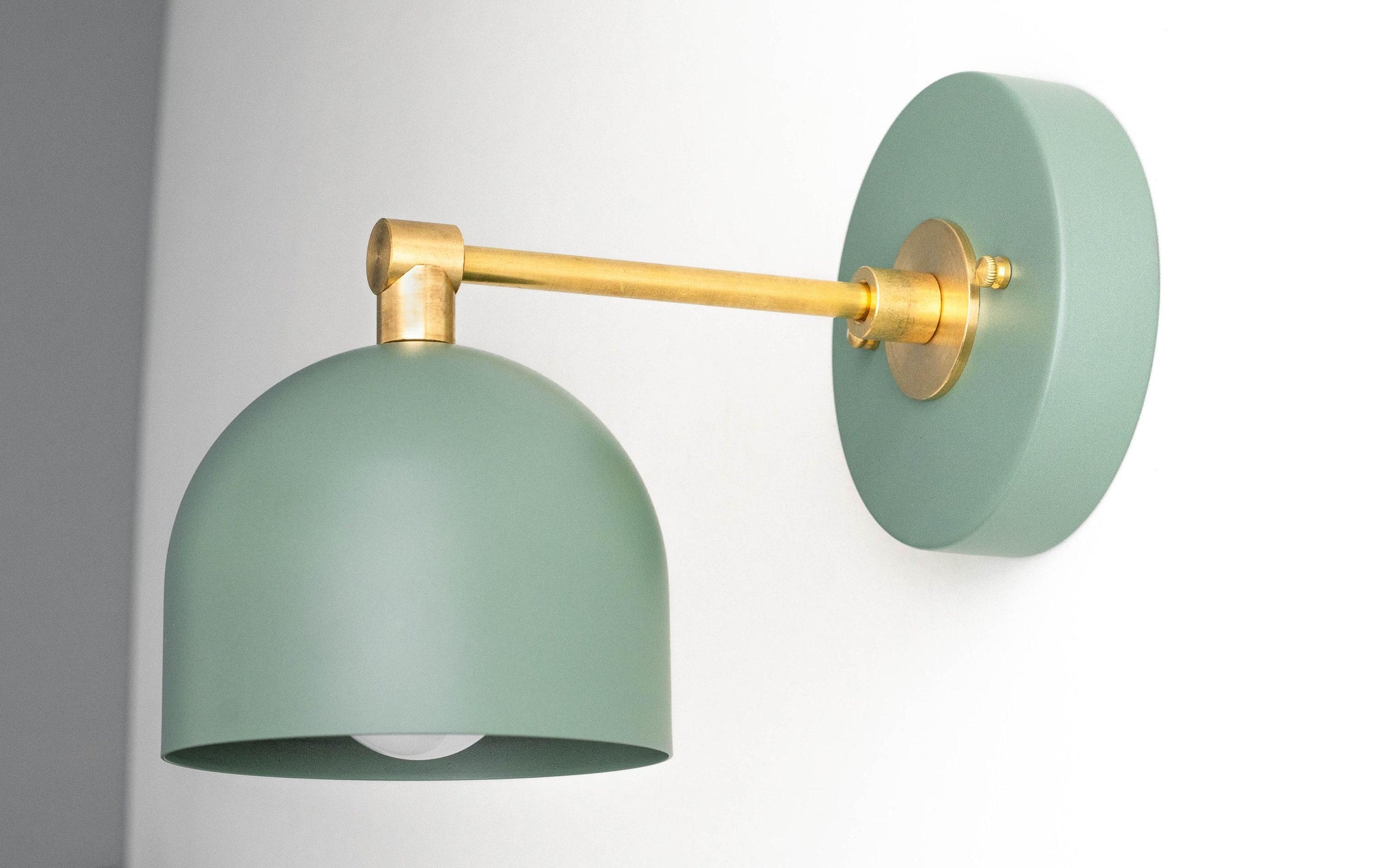Scandinavian-style green metal sconce with brass arm and round wall mount. - SCONCE MODEL NO. 3242