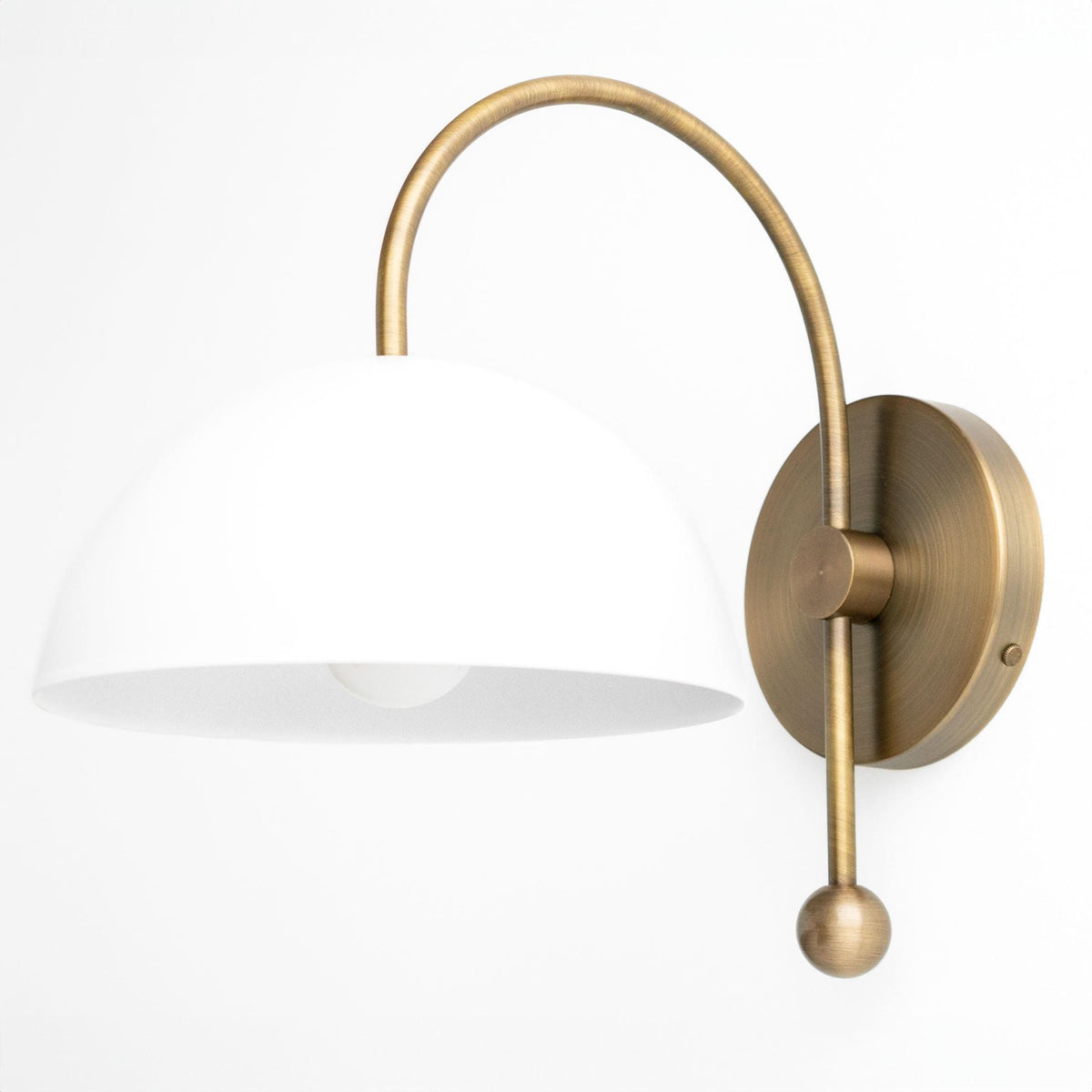 Sconce in Antique Brass with a wide steel dome shade on an arched arm with a ball finial. - SCONCE MODEL NO. 5732
