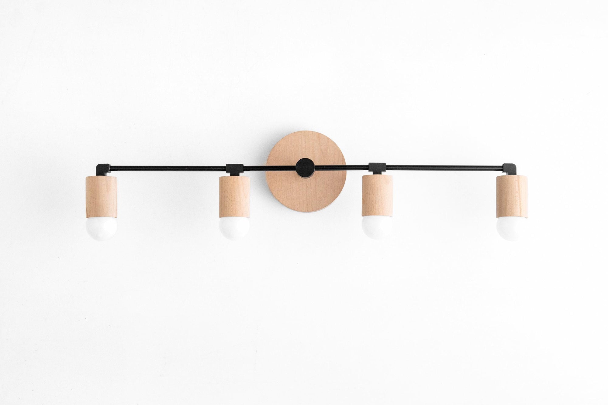 Four-bulb vanity light with black metal rod and natural wood accents on white wall. - VANITY LIGHT MODEL NO. 2017