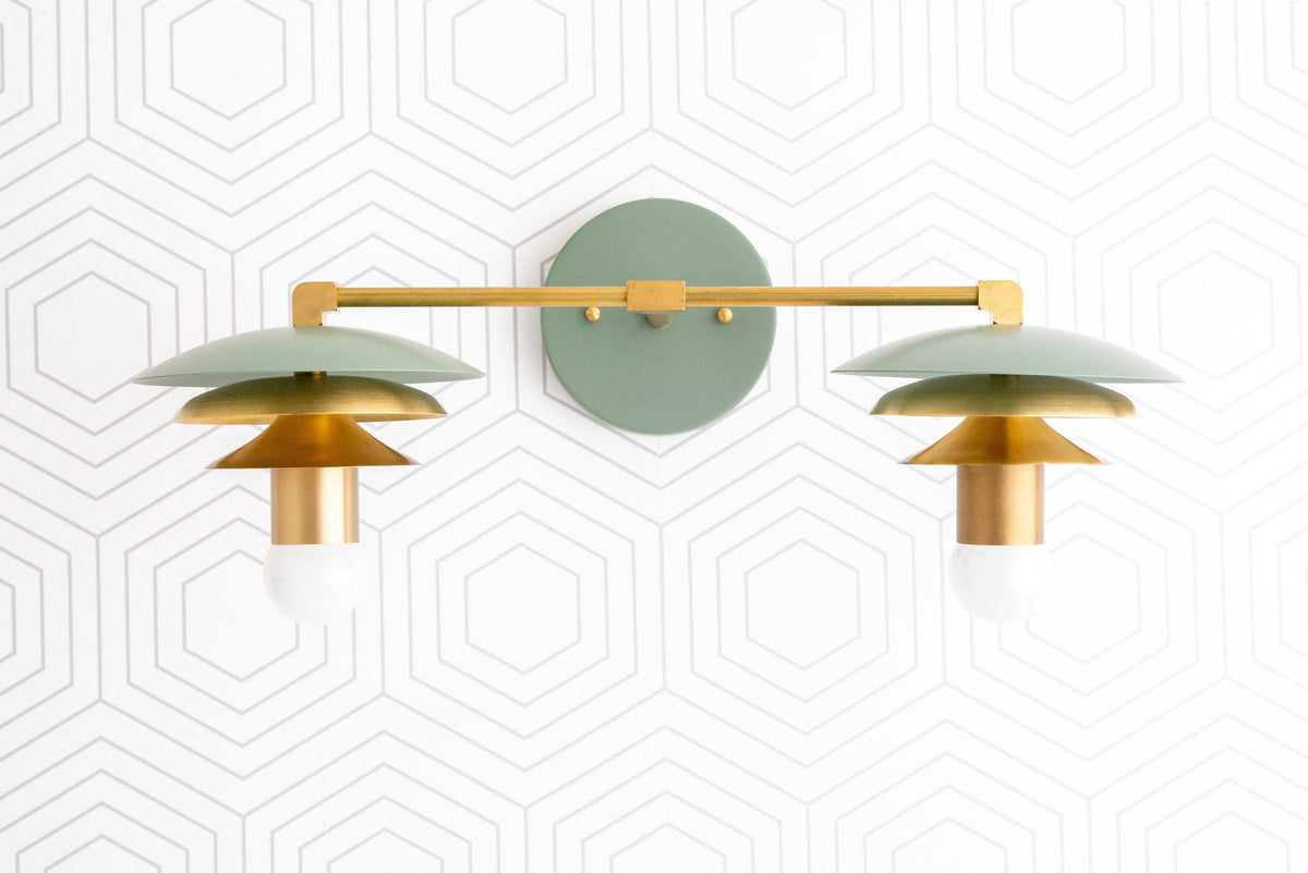 Raw brass dual-bulb vanity light with green Art Deco-style shades and round wall mount. - VANITY LIGHT MODEL NO. 5806