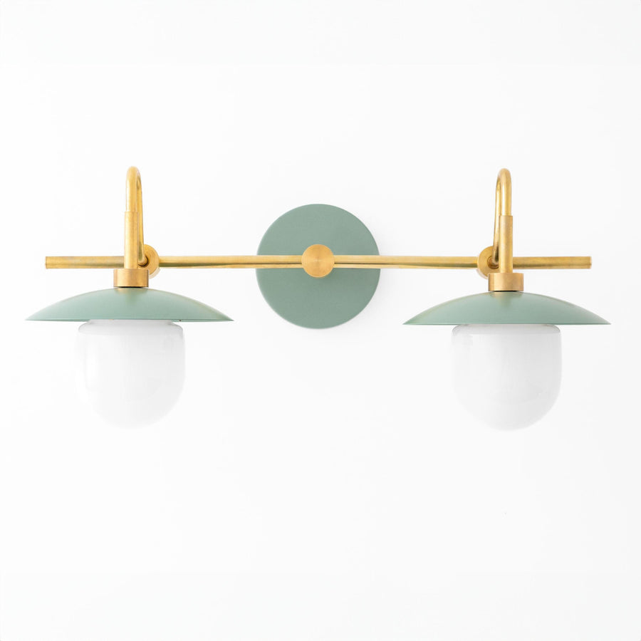 Two-bulb vanity light with raw brass finish and green conical shades, globe bulbs. - VANITY LIGHT MODEL NO. 0347