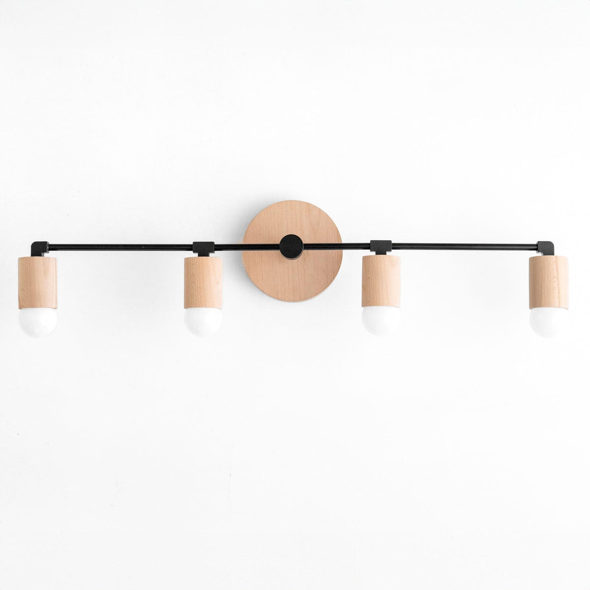 Four-bulb vanity light with natural wood accents and black metal frame. - VANITY LIGHT MODEL NO. 2017
