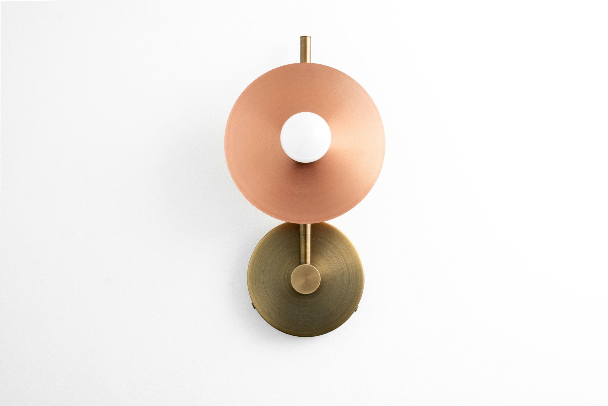 Art Deco wall sconce with round copper shade and raw brass circular base, bare bulb exposed. - SCONCE MODEL NO. 2693