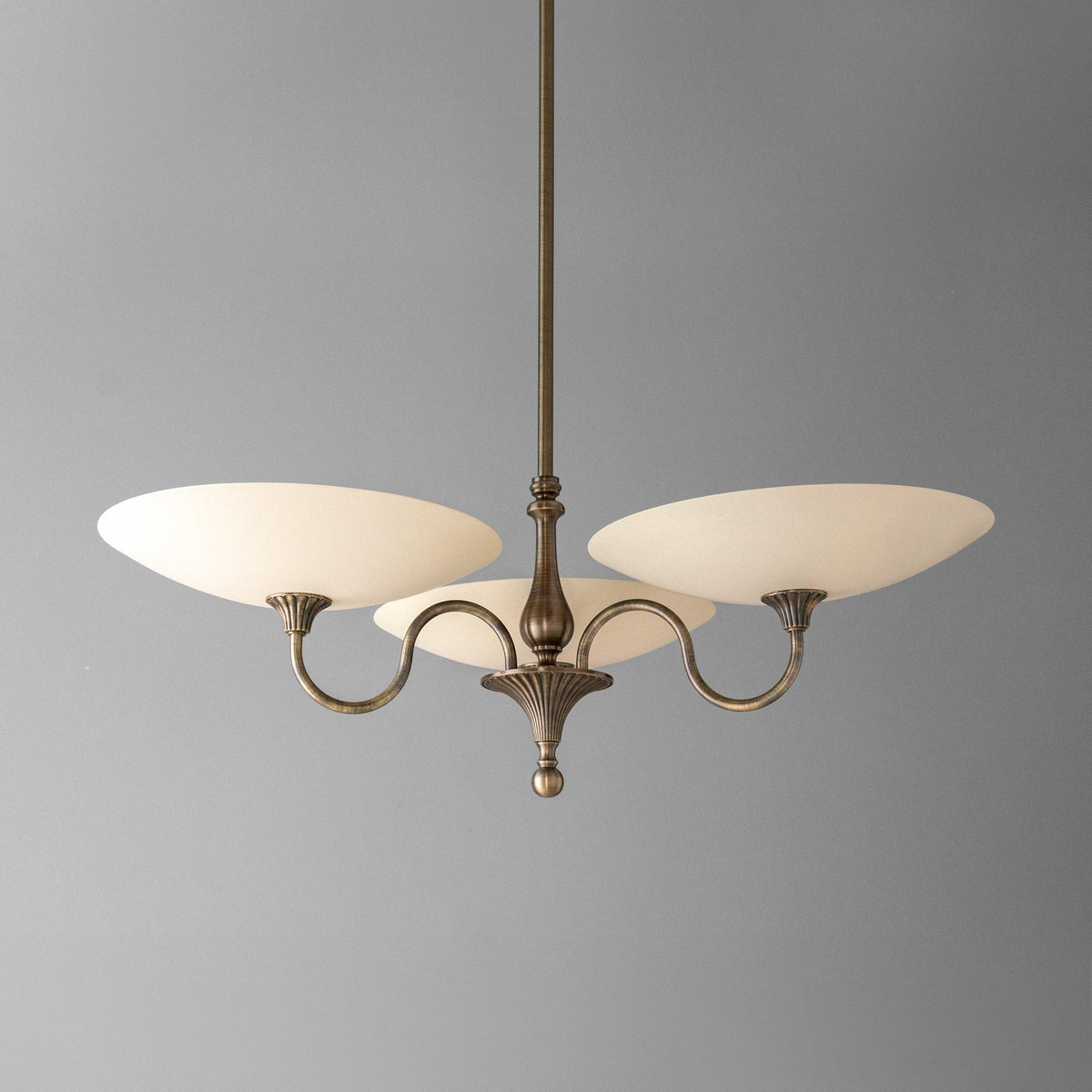 Antique brass chandelier with three cream glass globe shades and curved arms. - CHANDELIER MODEL NO. 1563