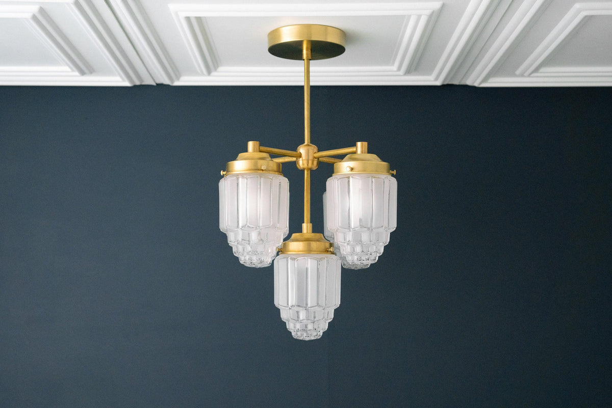 Art Deco chandelier with three ribbed globe glass shades and raw brass finish ceiling mount. - CHANDELIER MODEL NO. 0777