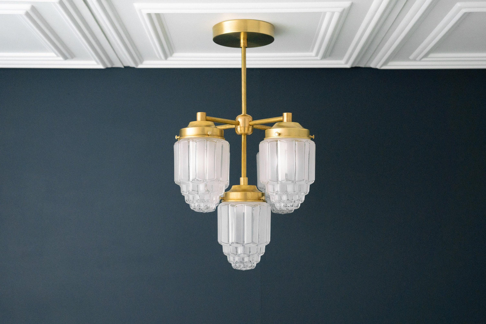 Art Deco chandelier with three ribbed globe glass shades and raw brass finish ceiling mount. - CHANDELIER MODEL NO. 0777
