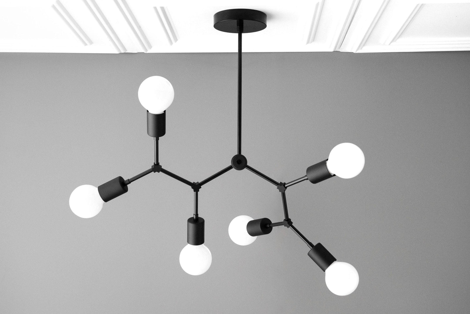 Black matte Art Deco chandelier with six exposed round white bulbs and angular arms. - CHANDELIER MODEL NO. 2523
