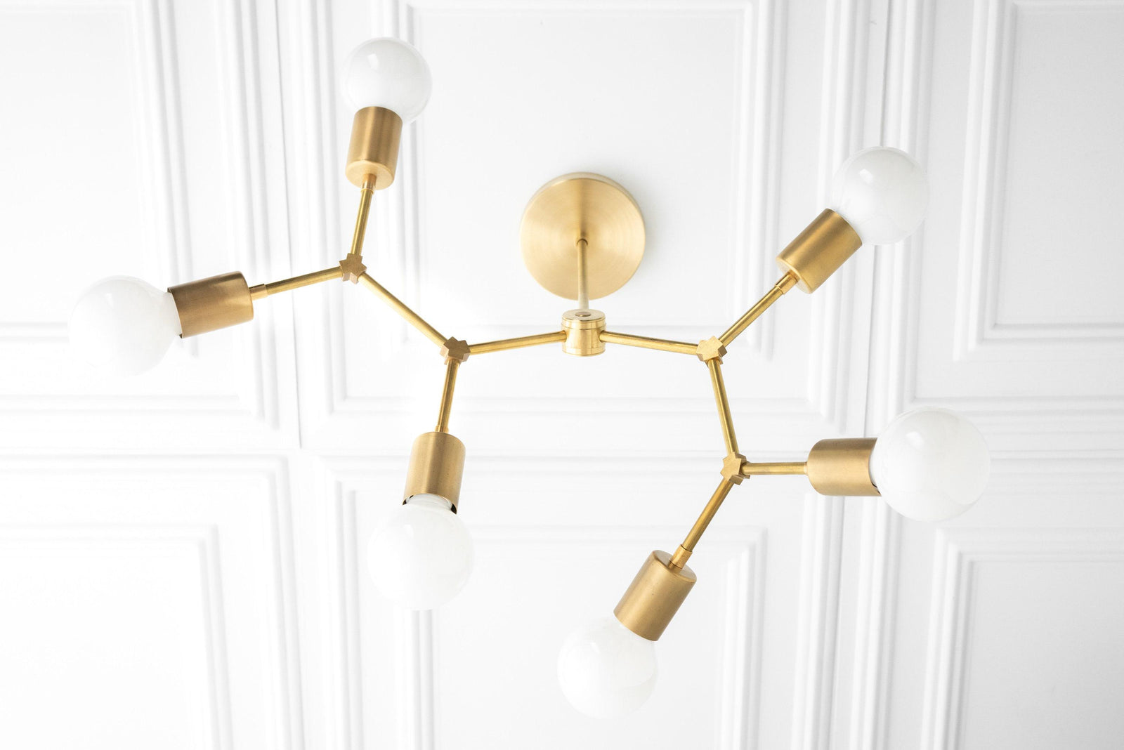 Art Deco raw brass chandelier with six angled arms and exposed bulbs, mounted on white ceiling. - CHANDELIER MODEL NO. 2523